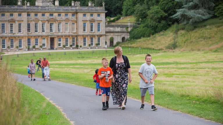 Visitors walking on the main drive at Dyrham Park, South Gloucestershire
